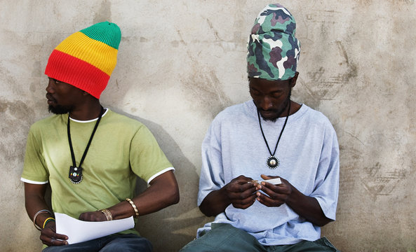 Rastafarian men smoking cannabis