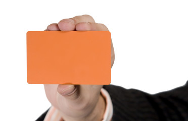 Blank Orange Visit Card in hand. Isolated on white