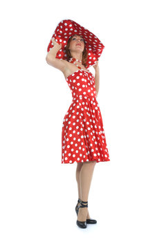 portrait redheaded with spotted dress on white background