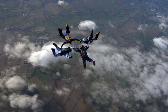 Skydivers building a formation