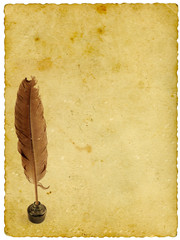 Hand writing with feather on old yellow paper