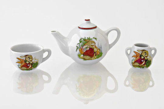 Rabbit tea or coffee set on a reflective white background