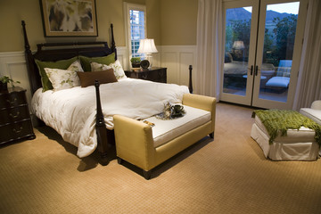 Designer bedroom with contemporary furniture and decor.