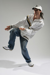 hip-hop dancer posing on a white background
