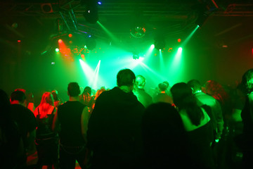 Dancing people in an underground club