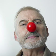 Serious man with red nose