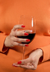 Glass of wine in a female hand