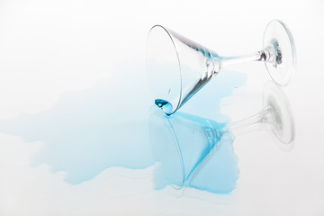 Dropped glass with blue liquid