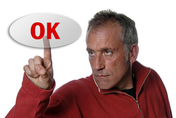 young business man presses ok key, isolated on white