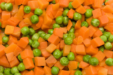 Orange carrot and green peas boiled and mixed