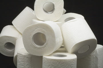 a lot of toilet papers on black background