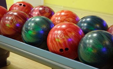 Fototapeta na wymiar several multicolored balls for playing bowling.