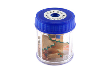 Plastic pencil sharpner with pencil and lead shavings in it.