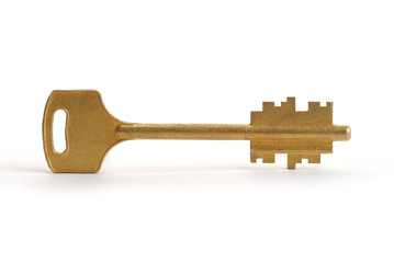 Gold key on white with soft shadow