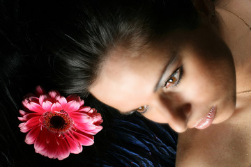 beautiful pink flowers in girl hair
