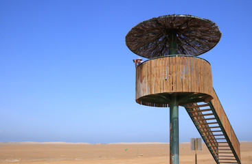 Man in a birdwatching tower (Punta del Fangar,  Spain)