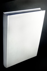 white book isolated on black background