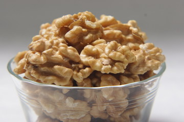 A bowl full of walnuts.