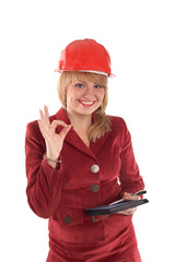 A businesswoman in a helmet showing sign 