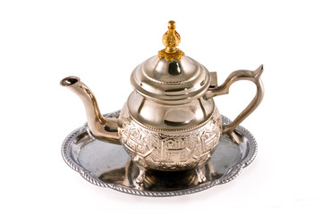 Ancient silver teapot on a white background