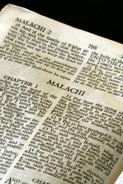 holy bible open to the book of Malachi in the old testament