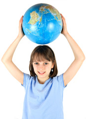 Young girl holding a globe against a white background