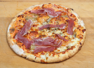 Pizza with porcini mushrooms and proscuitto ham