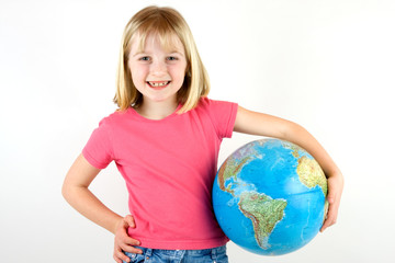Girl holding a globe under her arm against white background