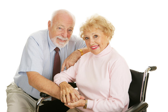 Attractive senior couple - the wife is in a wheelchair. 