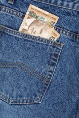 a blue jean and canadian dollars