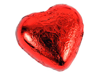 A bright red candy heart against a white background