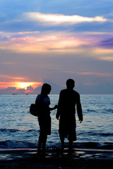 man and women has serious conversation at sunset