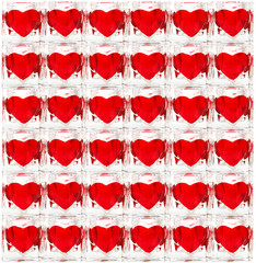 Background made of glass tiles with red hearts