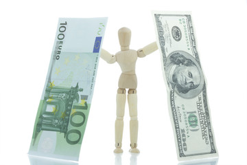 Manikin holds falling dollar and euro bills