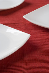porcelain plates in a perspective over red 