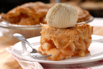 Piece of deep dish apple pie with vanilla ice cream