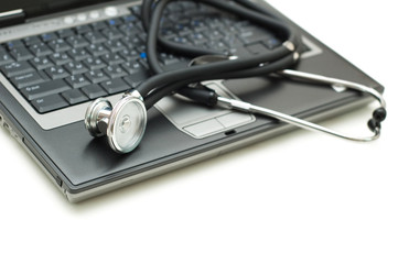 Stethoscope and laptop illustrating concept of digital security