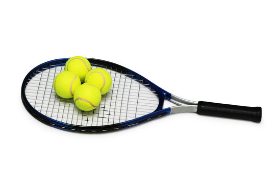 Tennis rackets and four  balls isolated on white