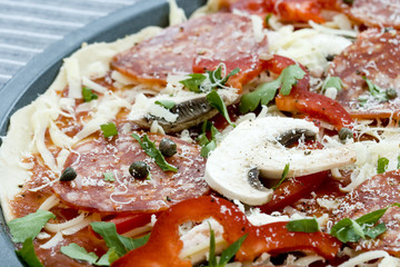 Close-up of uncooked pizza ready for baking