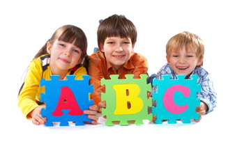 Children with Alphabet Puzzle