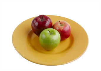 Apples on Bright Yellow Plate Isolated on White Background