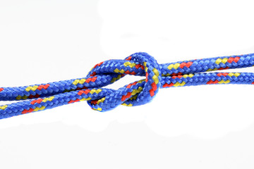 square knot tied on a rope isolated over a white background