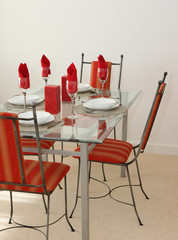 Dining table with four settings laid out