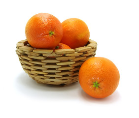 oranges in wooden bowl on a white background