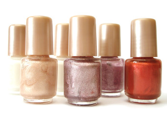 white, red and pink nail polish on white background