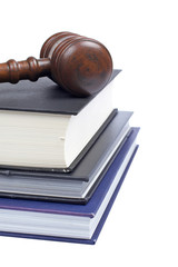 Gavel and law books isolated on white background. Shallow DOF