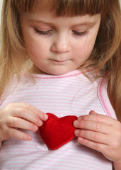 pretty child with red heart