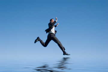 Fototapeta premium Businessman jumping in the air