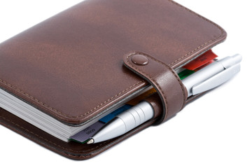 pocket planner and pen isolated