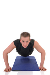 Young handsome  male doing fitness exercises in the gym. 